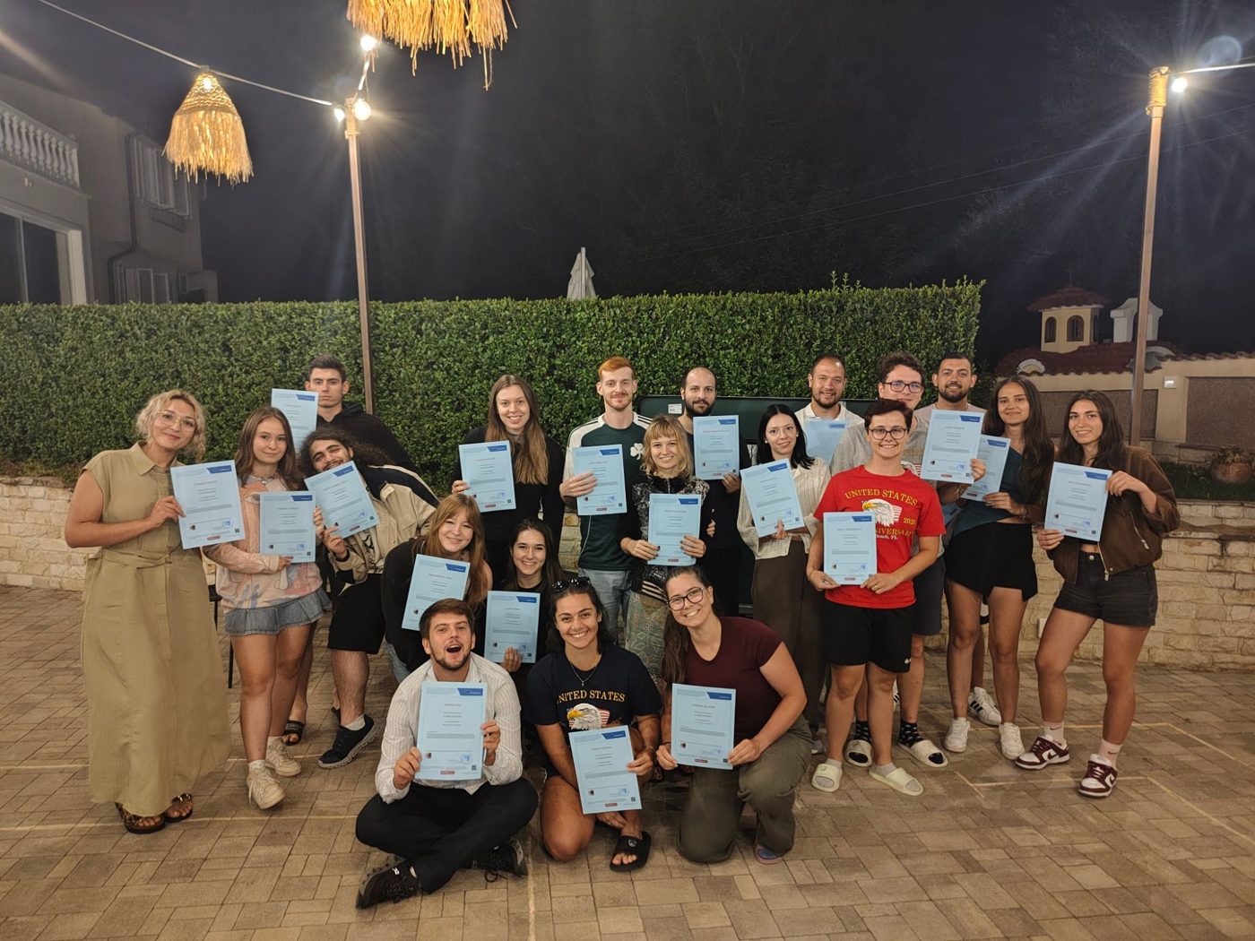 The participants holding their Youthpass certificates on the last evening