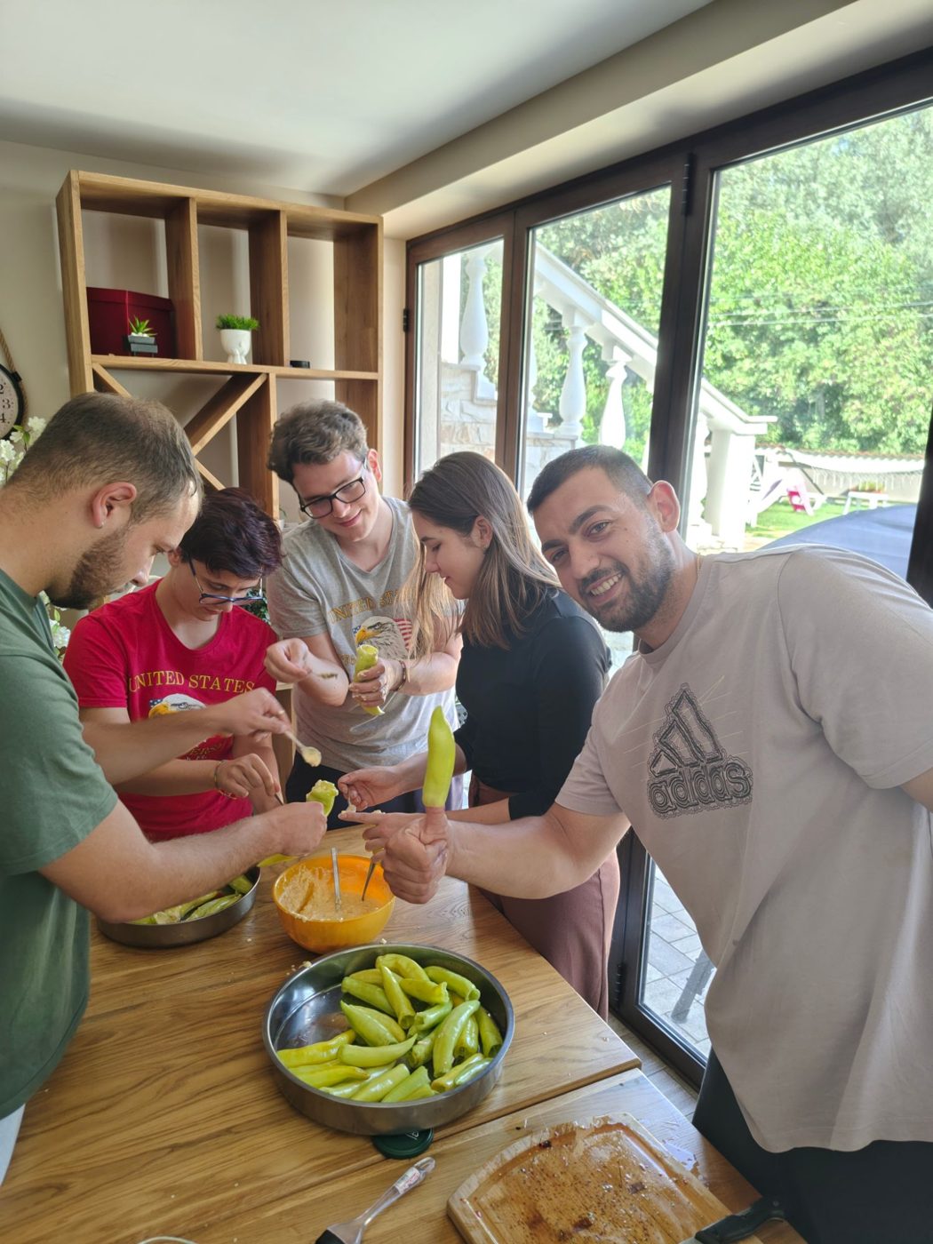 Participants fill peppers with a cheese filling