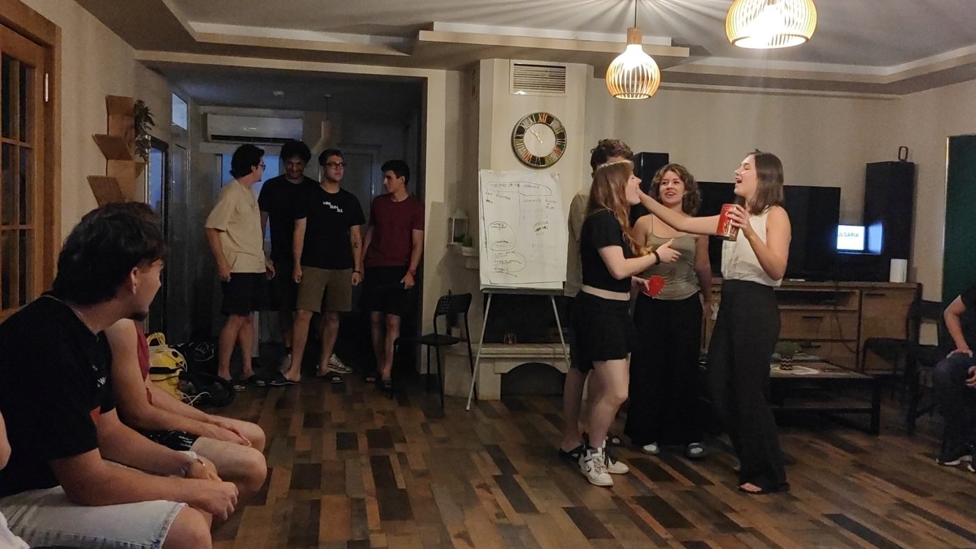 An evening scene in progress while the rest of the group watches