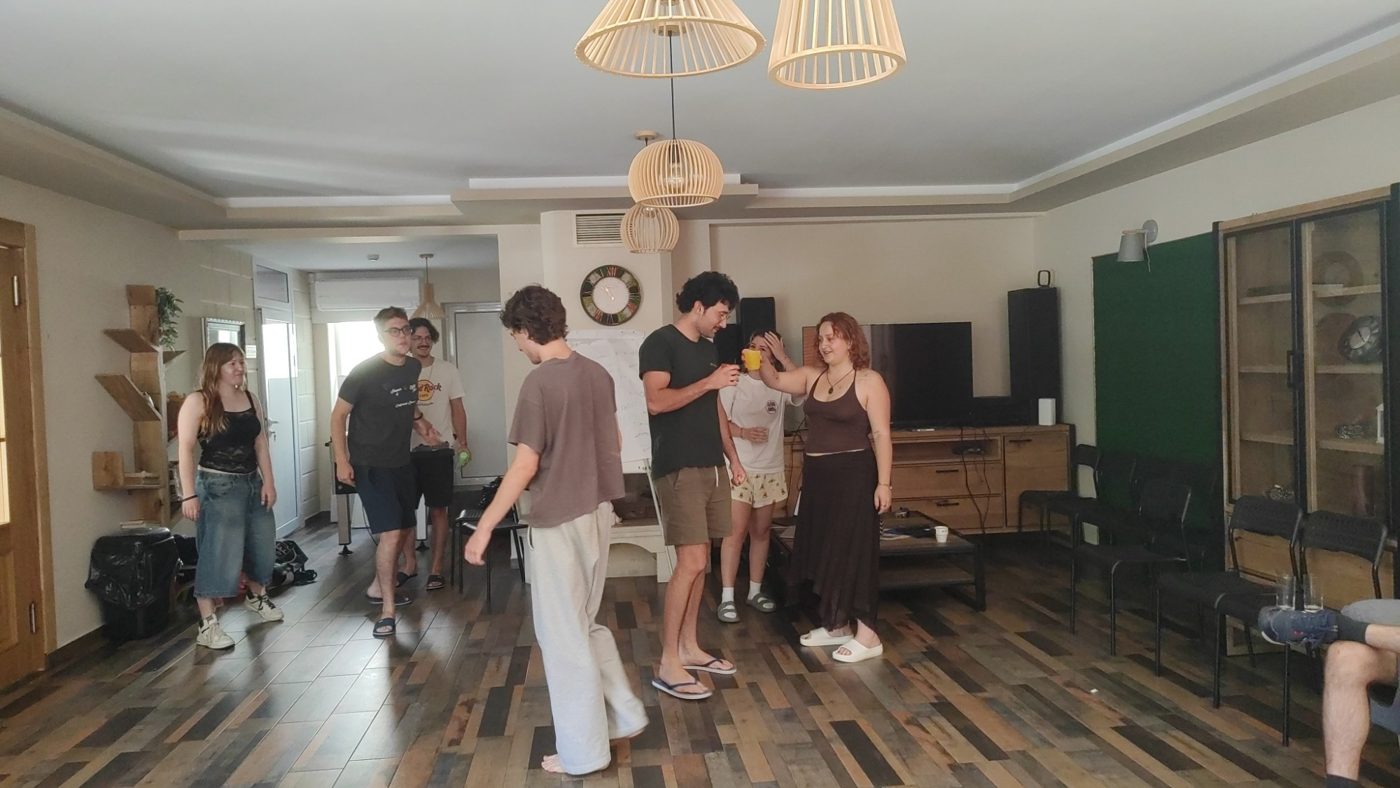 Participants laugh together during a theatre game