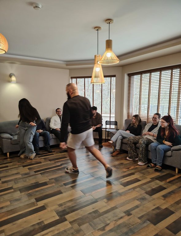 A participant leading an exercise in the training room