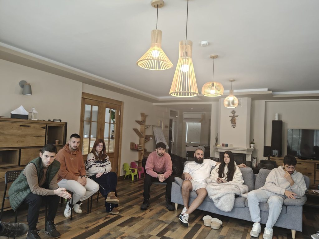 Participants seated on sofas during a session
