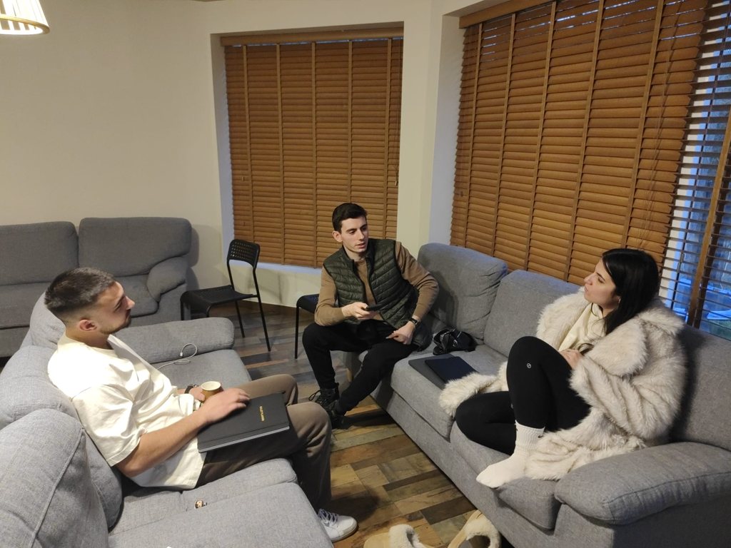 Participants talking on sofas