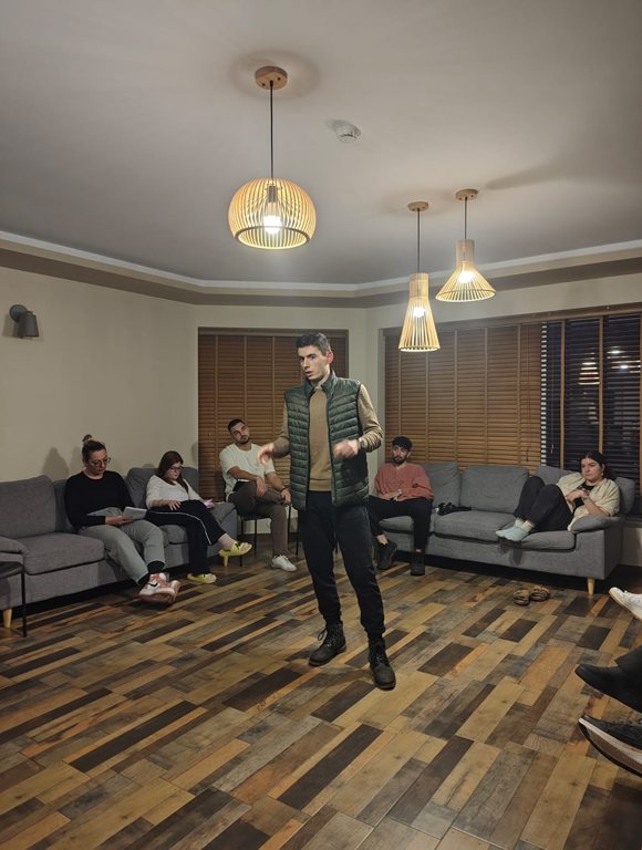 A participant speaking in front of the group