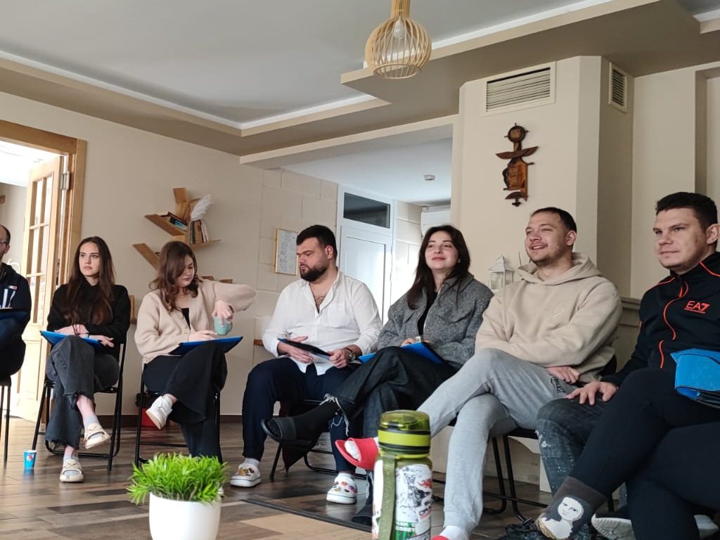 Participants seated in a circle