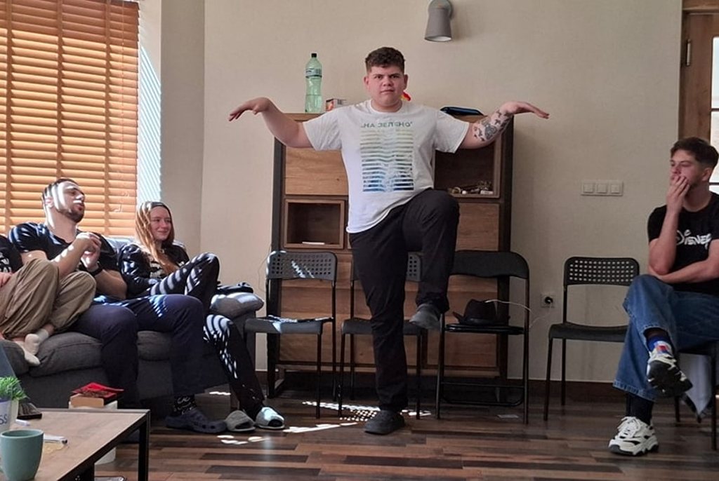 A participant performing an exercise in front of the group