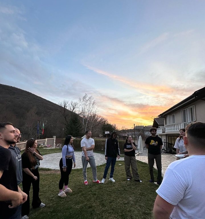 Participants outdoors at sunset