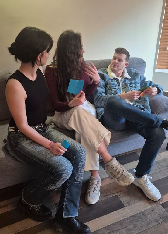 Participants talking on a sofa