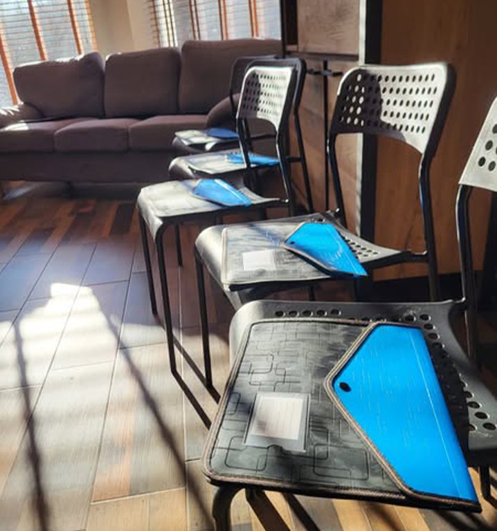 Tablets laid out on chairs for an activity