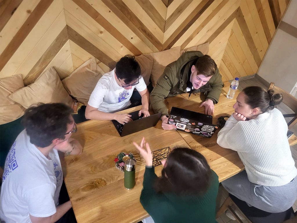 Participants playing a game at a table
