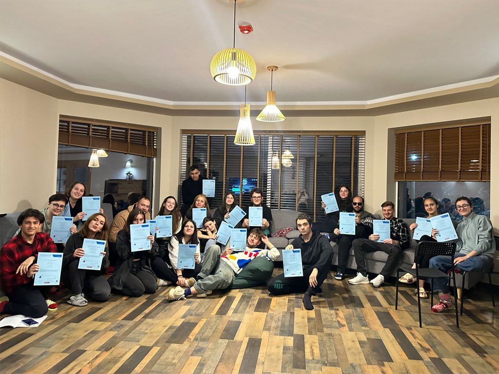 The whole group holding their Youthpass certificates