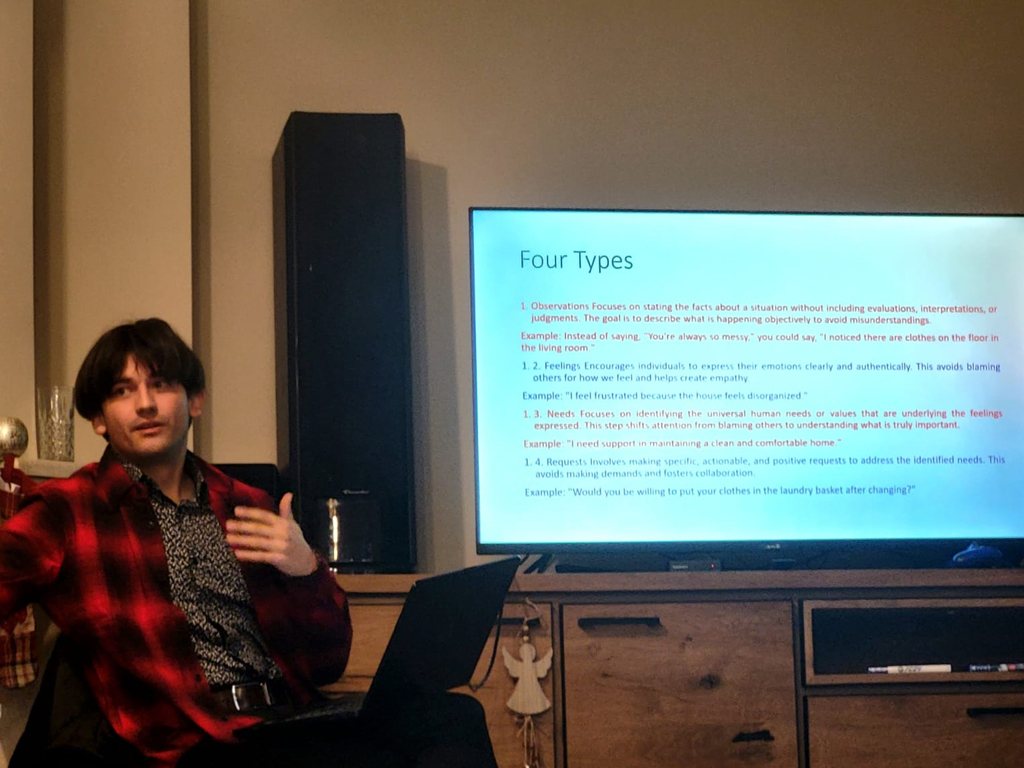 A participant presenting a slide to the group