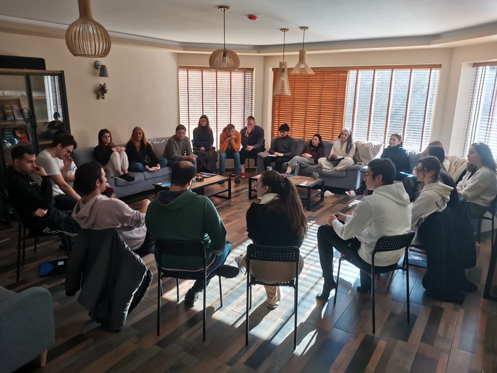 The group seated in a circle