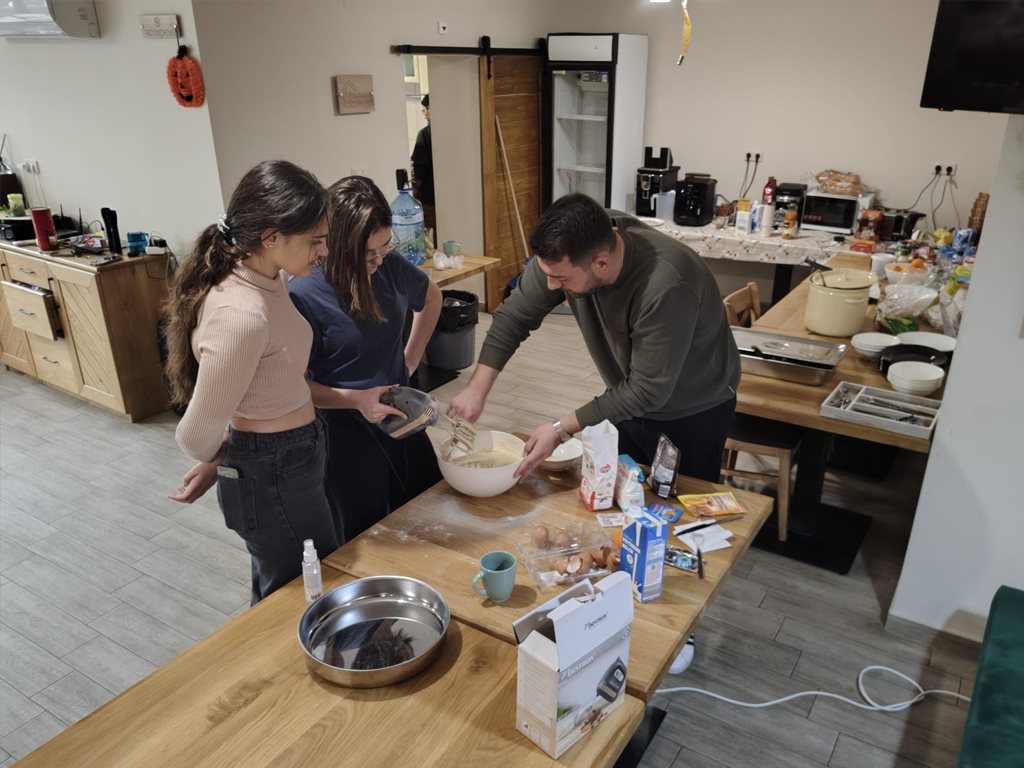 Participants preparing food together in the kitchen
