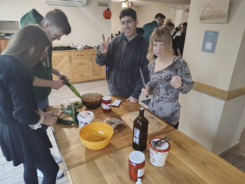 A team chopping vegetables and preparing a recipe