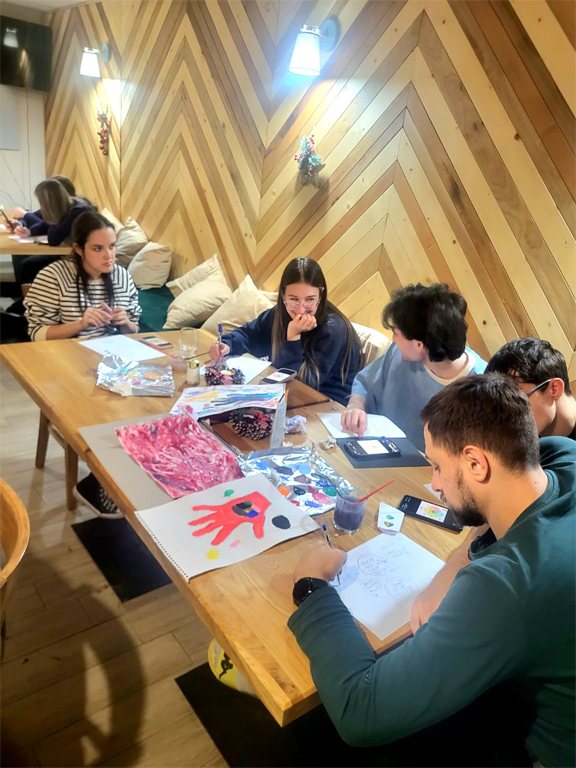 Participants working on a creative task at a table