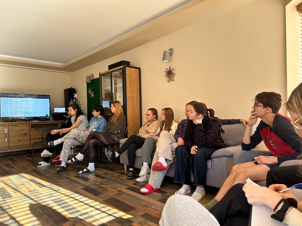 Participants seated in the sunny training room
