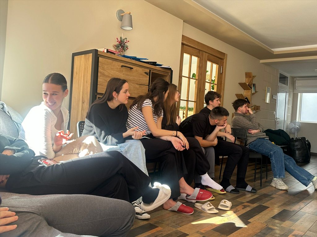 Participants sitting together on a sofa