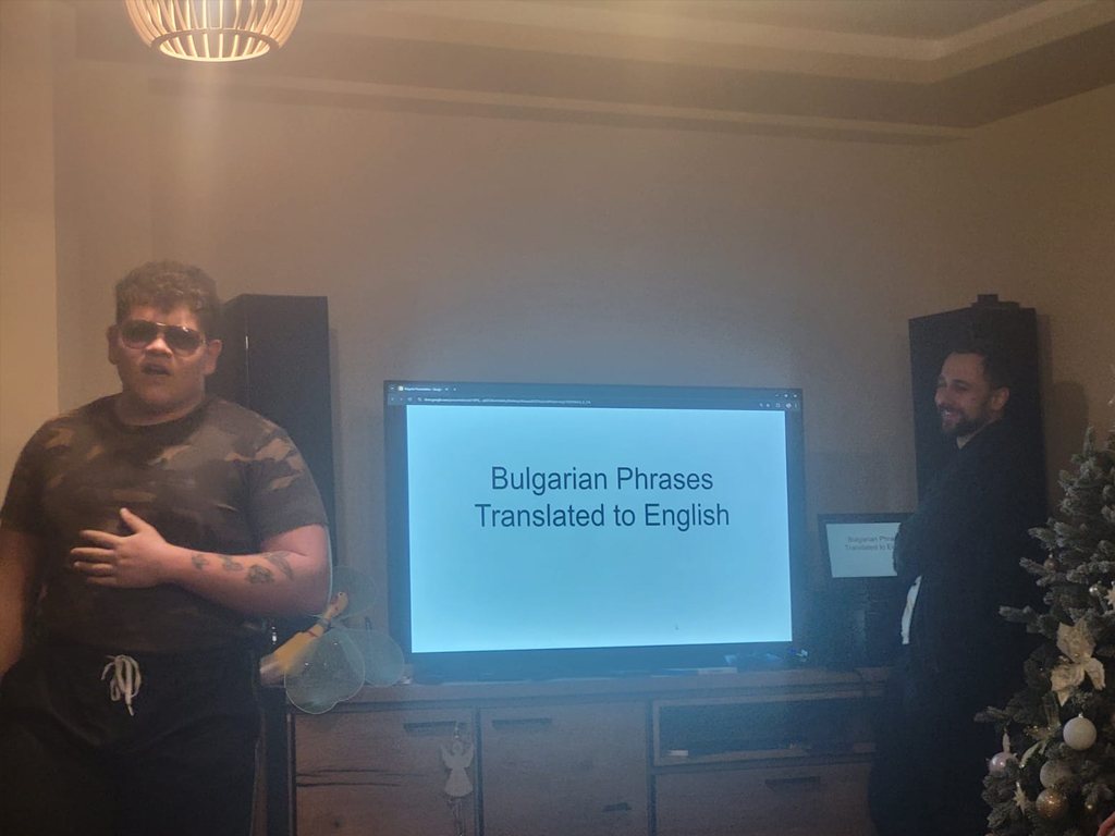 A participant presenting Bulgarian phrases translated to English