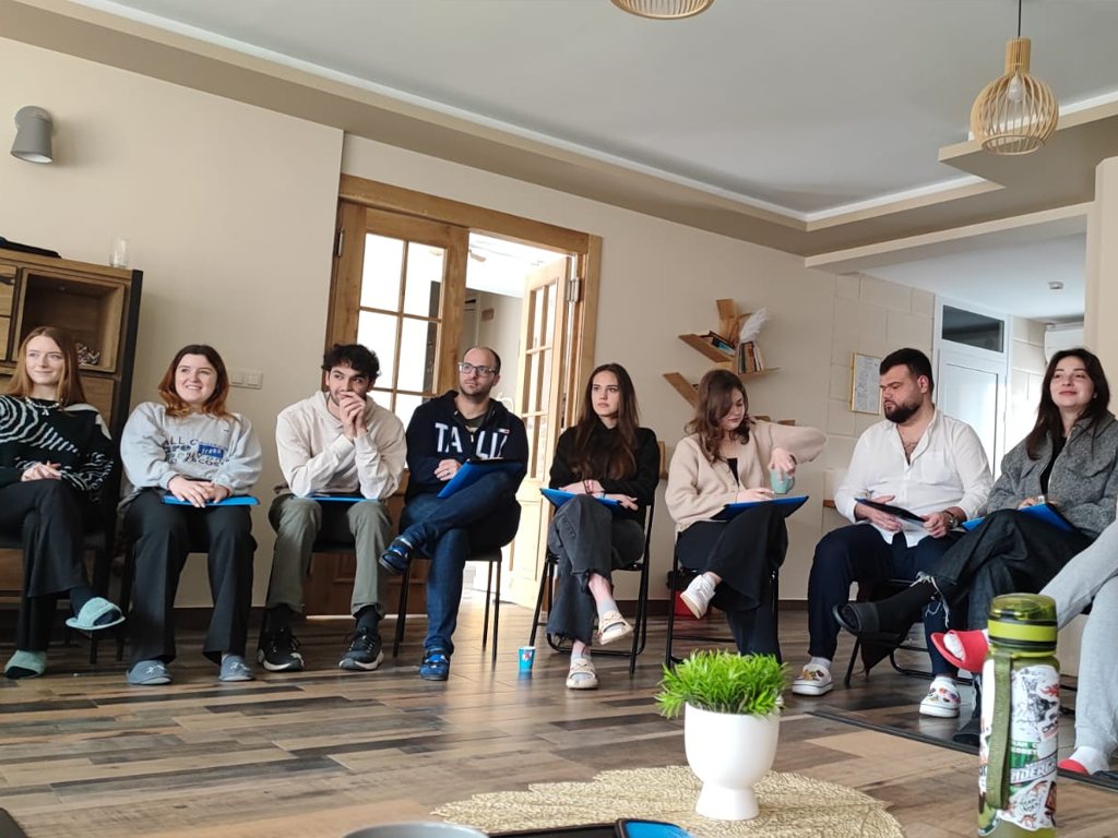 Participants seated in a circle during a session