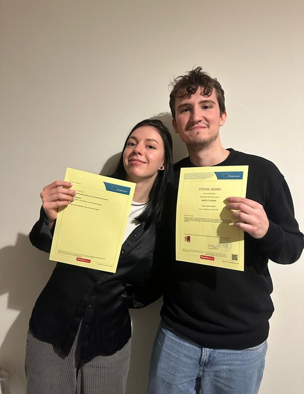 Two participants holding their Youthpass certificates