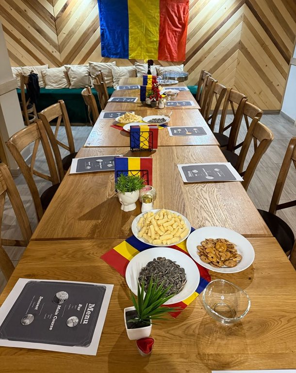 A long table set for a cultural evening